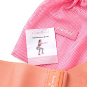 Pink resistance band with a label and instruction sheet